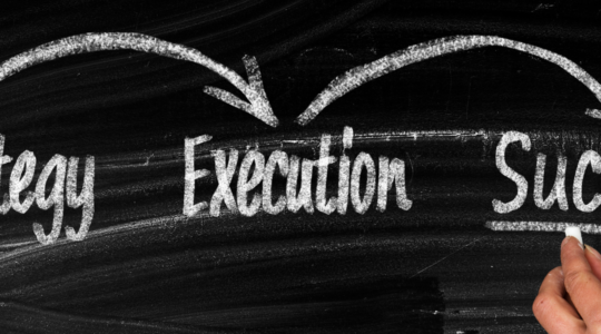 chalkboard-with-words-strategy-execution-success